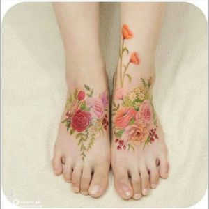Beautiful colour realism flowers, leaves & stem feet tattoo #dreamtattoo #mydreamtattoo