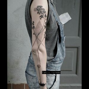 Cool long lines black & grey plant sort-of sleeve tattoo