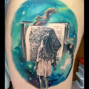 Super cool black & grey, girl in a dress reading a large book with a cold realistic galaxy/universe background tattoo #dreamtattoo #mydreamtattoo