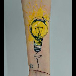 Cool yellow paint splatter & light bulb tattoo#dreamtattoo #mydreamtattoo