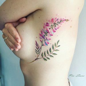 Beautiful colour foxglove with stem & leaves side-boob tattoo#dreamtattoo #mydreamtattoo