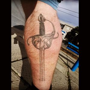 Rapier blade to commerate my fencing. #fencing #sword #calftattoo #painful #blackandgrey #snowwhite #ink #loveit