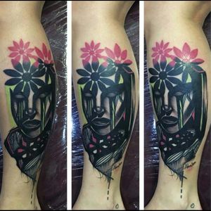 Interesting black & grey portrait style, with pink flowers & green strokes tattoo
