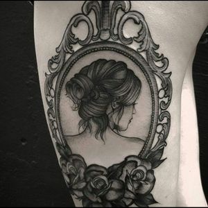 Awesome black & grey woman's portrait inside a frame with traditional roses tattoo #dreamtattoo #mydreamtattoo