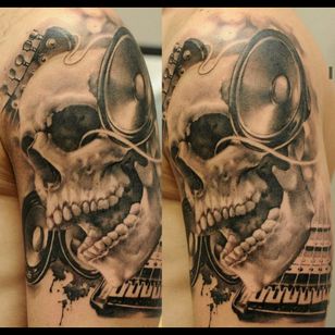 Awesome hyper realistic skull with music speakers, guitar had, piano tattoo #dreamtattoo #mydreamtattoo