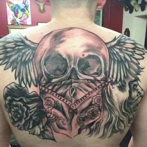 Tattoo done by diffrent artist #backpiece #back #skull #bandana #wings #rose #lion #big #largescale