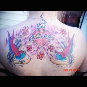 An older tattoo - done about a decade ago or so. #sparrows #sacredheart #stars # clouds #flowers #cherryblossoms