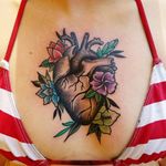 My fifth tattoo done by Troy Clements at Naked Art Tattoo in Odenton, MD. #nakedarttattoos #anatomicalheart #blackandgrey #flowers #heartwithflowers #chestpiece #sterunum