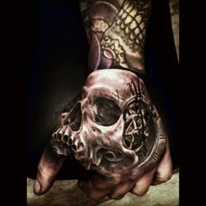 Such a huge fan of skull hand tattoos