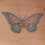 This is my first tattoo. It's for the 4 generations of women in my family who were alive together. The pink and yellow are for my great-grandma. The black and red are for my grandma. The green and mauve are for my mom, and the blue and purple are for me. The butterfly also symbolizes a new creation, as I was going through some life changes at the time. #butterfly