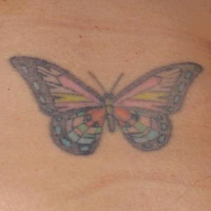 This is my first tattoo. It's for the 4 generations of women in my family who were alive together. The pink and yellow are for my great-grandma. The black and red are for my grandma. The green and mauve are for my mom, and the blue and purple are for me. The butterfly also symbolizes a new creation, as I was going through some life changes at the time. #butterfly