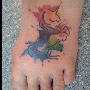 Rainbow watercolor unicorn  by Lisa at Taylormade Tattoos,  King's Lynn,  UK.