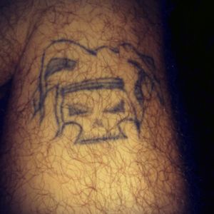 This was one of my first tattoos. It was supposed to be a skull wearing a jester hat