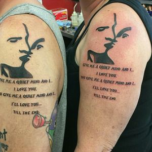 Original couples  tattoo. Sillouette of my husband  and I from a photo on our wedding day and a song lyric with special  meaning to us.