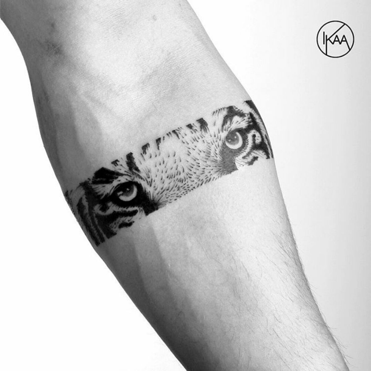 Tattoo uploaded by Claire • By #lkaatattoo #armband #blackwork #tiger #eye  #dotwork #blackink • Tattoodo