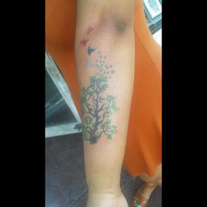 Covers a mole that was in middle of forearm; now part of tree base.
