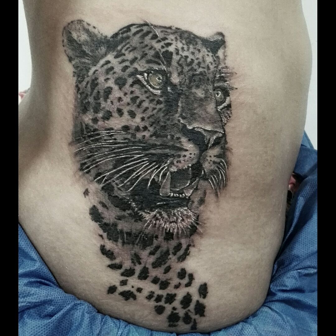 Black and gray realism tattoo Portrait of a jaguar on the left pectoral   Jaguar tattoo Black and grey tattoos Jaguar chest tattoo