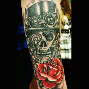 Black and grey Steampunk skull with red rose