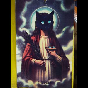 Vintage Saint Lucia card with blue eyed black cat for face.