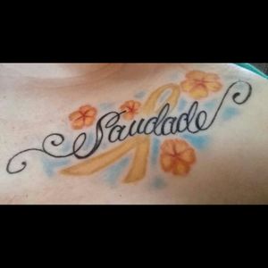 #megandreamtattoo  Would like this word with a different script and the Alzheimer's ribbon as the background with forget me not flowers as a memorial to  my Portuguese grandmother.  The word Saudade exists only in the Portuguese language and means the love that remains after someone is gone.