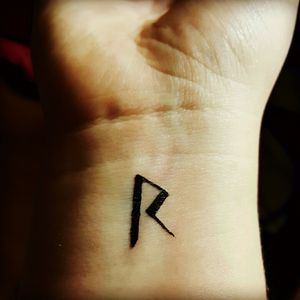 Viking rune "Raidō" meaning ride or journey; coincidentally it also looks like the letter R, which is the first letter of my last name. #eyeliner #tattoo #testrun #scandinavian #rune #ride #journey #wrist #maybesomeday #smalltattoo #wristtattoo