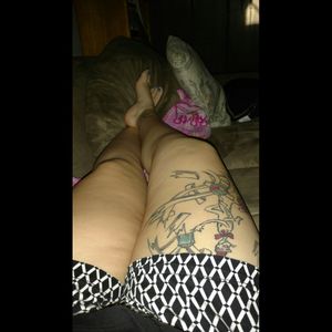 Laying on the couch eyeballing my tattoos lol. I want more