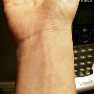 White ink triquatra on my right wrist, for my love of the old religion. Wicca.