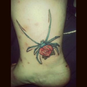 Mechanical spider with rose another breaking point in my life told in this tattoo.