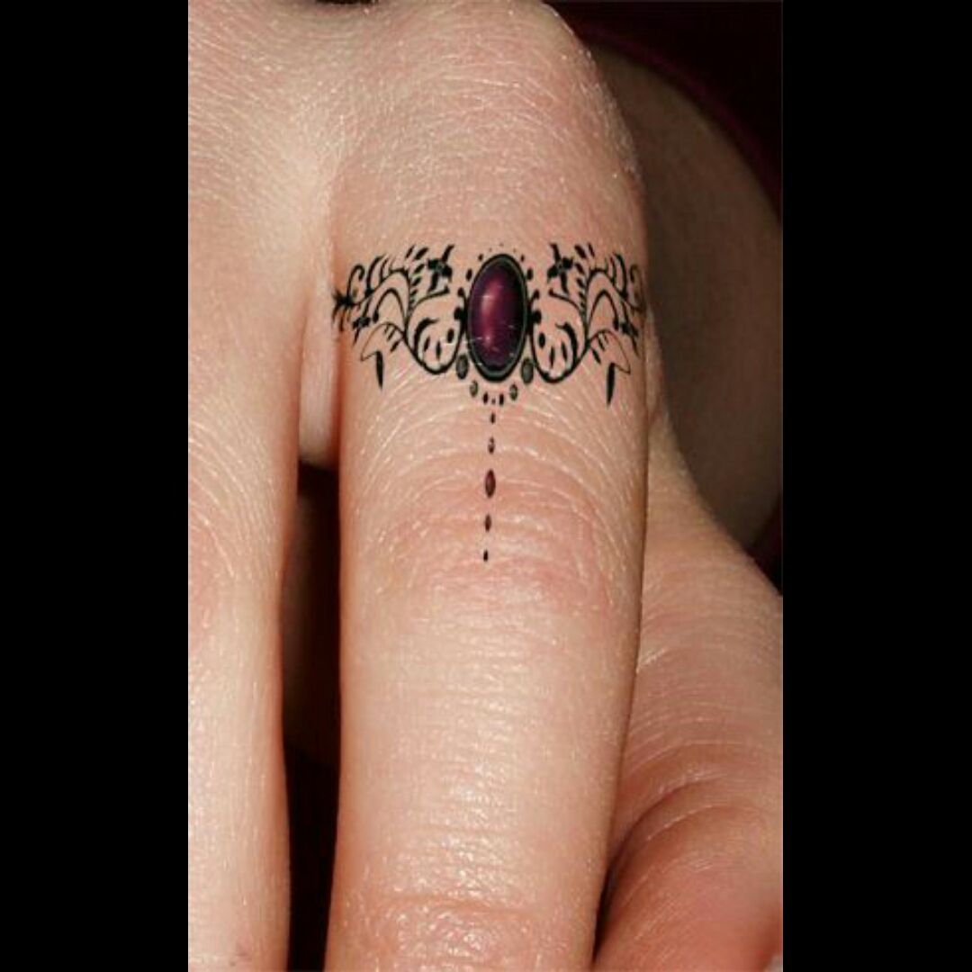 49 Elegant Cross Tattoos On Finger