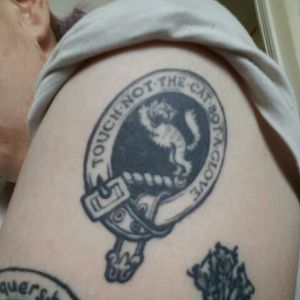 This was my first ever tattoo 22.01.2014. It is also one of my favourites. It is the Scottish clan emblem of the Mackintosh clan to which I am directly related. At present I am the only living Mackintosh in my family line so I felt it was important to signify this. The crest of a wild cat is bordered with the motto: "touch not the cat bot a glove" which means to not go into battle unprepared