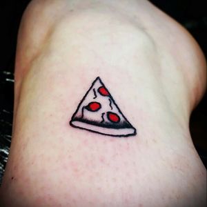 Pizza party. Done by my friend and piercer who has never touched a machine before. He also said he only knows how to draw pizza so its a good thing I love it so much.