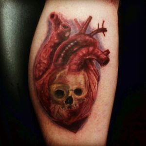 A heart and skull tattoo