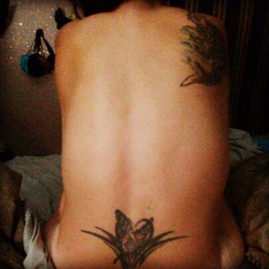 atypical tramp stamp butterfly tribal= 18 & no one can tell me no now lol