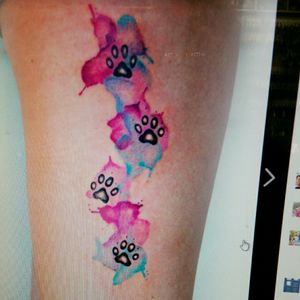 This is the next tattoo I would like. I would like little dog bones under each one with my dogs names in them...there would need to be 8 paws with bones.