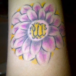 This is on my wrist itaco lotus flower with my daughter's sign