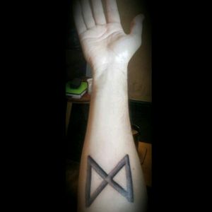 Dagaz, Saxon/Nordic rune, meaning light after darkness, the coming dawn, breakthrough and opening. And also the sign for the letter D... my intial. :)