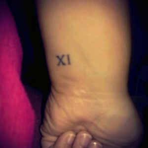 My Roman numerals wrist tattoo #11. Number 11 has always been my lucky and favorite number. My birth month is #11, and I graduated from high school in 2011.