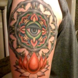 This is my 1st tattoo all seeing eye to watch over me, two sets of gears for my love of all things mechanical, stone cross n the background is my backbone and the lotus a water flower for the water sign of Aquarius that i am.