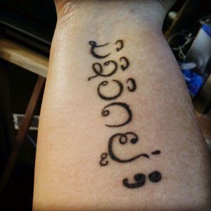 Tattoo says alive in Laotian and had a semi colon for depression and anxiety awareness. I suffer from birth and have attempted suicide. I wear this tattoo to remind myself that I'm alive and not alone.