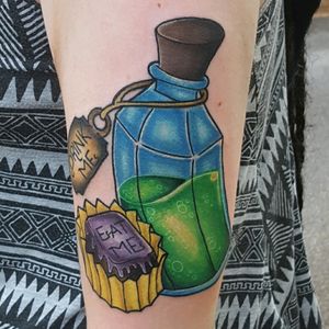 Alive in Wonderland bottle and cake tattoo by Sam Ramsey