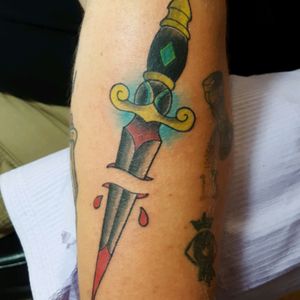 Traditional dagger tattoo by Sam Ramsey