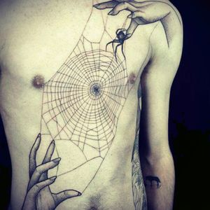I found this tattoo and I've been looking for an Spider design for a long time. I'll probably get this but with tree branches instead of hands.