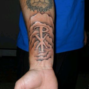 The Chi-Rho. Christian symbol. I wear it as a symbol of God's victory. It's a good conversation starter, although a lot of people think its a gang symbol, LOL