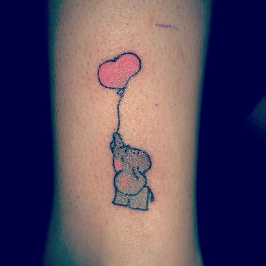 Baby Elephant With Heart Shape Balloon Tattoo On Wrist