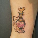 Poison bottle at Halloween walk-in day by Marco Jarry, Cubano Ink Munich #poisonbottletattoo #poison #potion #bottle #drink #magic #witchcraft #bone #bones #cubanoink #marcojarry #jarrytattooer #cubanoinkmunich #münchen #neotraditional #neotraditionaltattoo #traditional