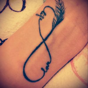 infinity symbol with feather love life