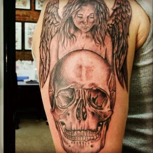 Skull with guardian angel. Still needs background filled in.#HardwiredTattoo  #ChuckCorrell