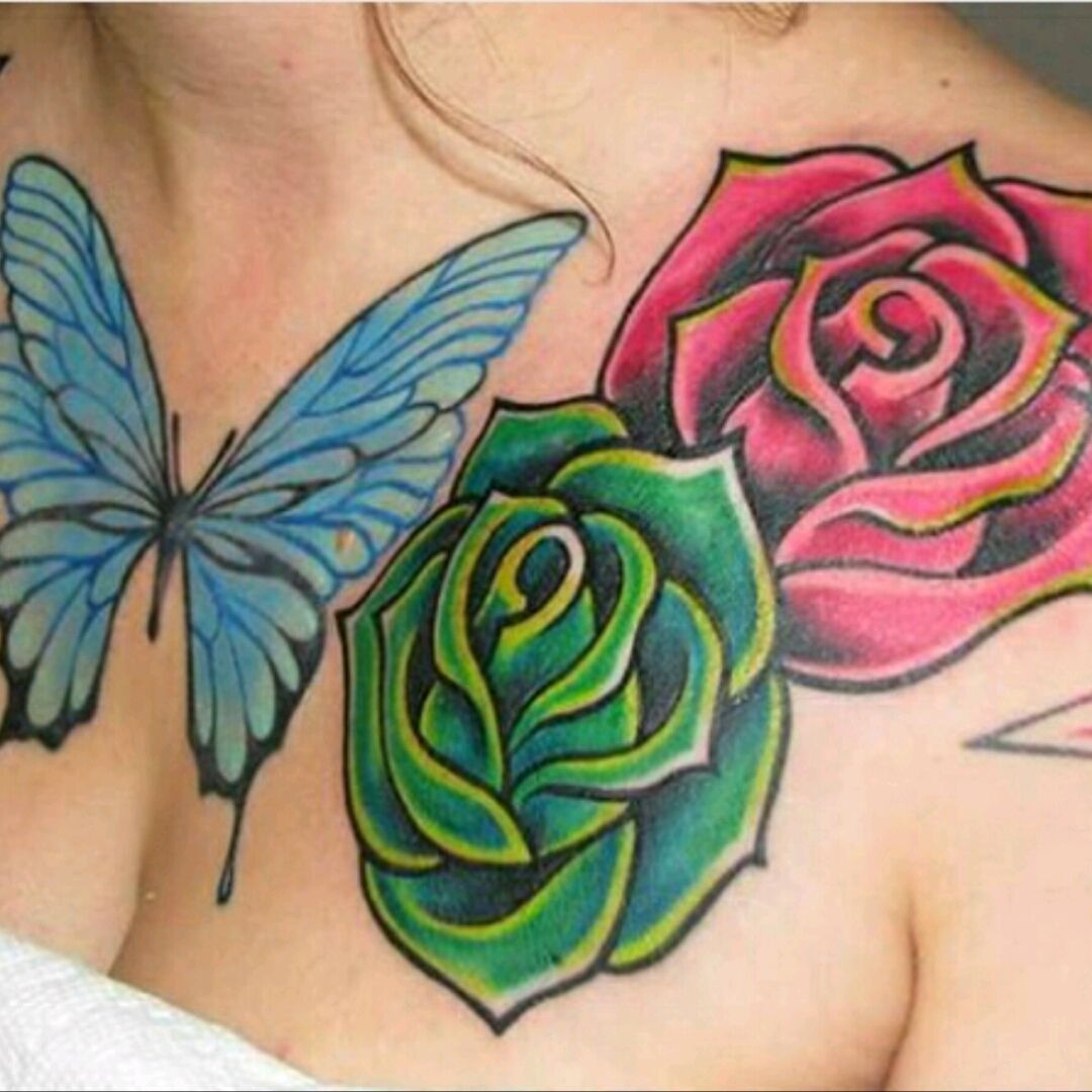Red and green small rose tattoo on arm for women
