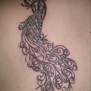 Beautiful peacock, designed by my tattooist. Love it.