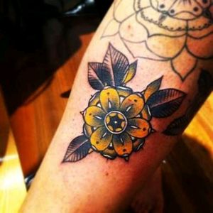 #tattoo #design #tattoodesign #color #colour #art #bodyart #idea #lotus #flower #flowers #yellow #plant #traditional yellow traditional flower tattoo by an unknown artist. ☺